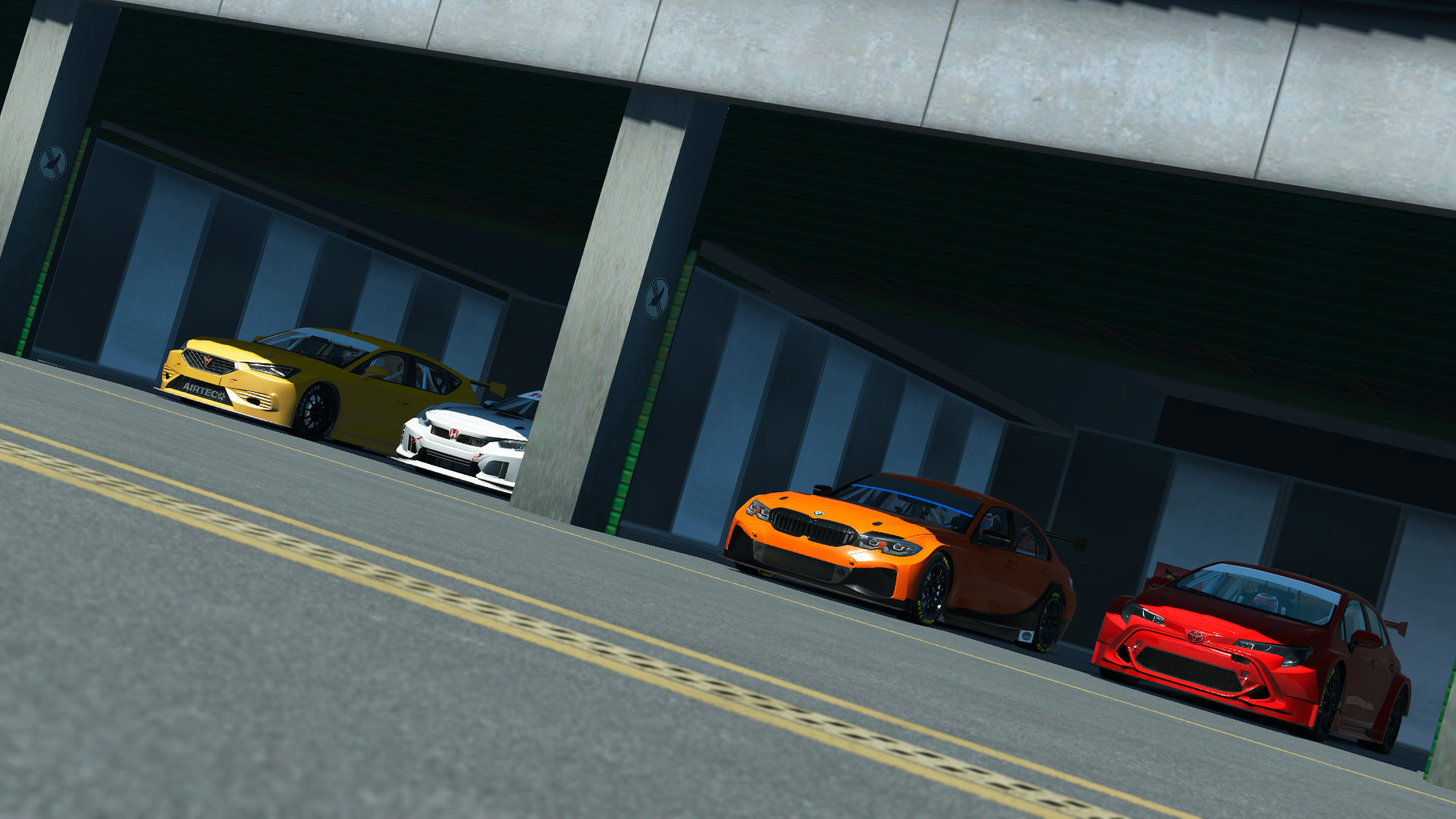 Carros do VTCC 2026 alinhados nas boxes antes da abertura das inscrições.